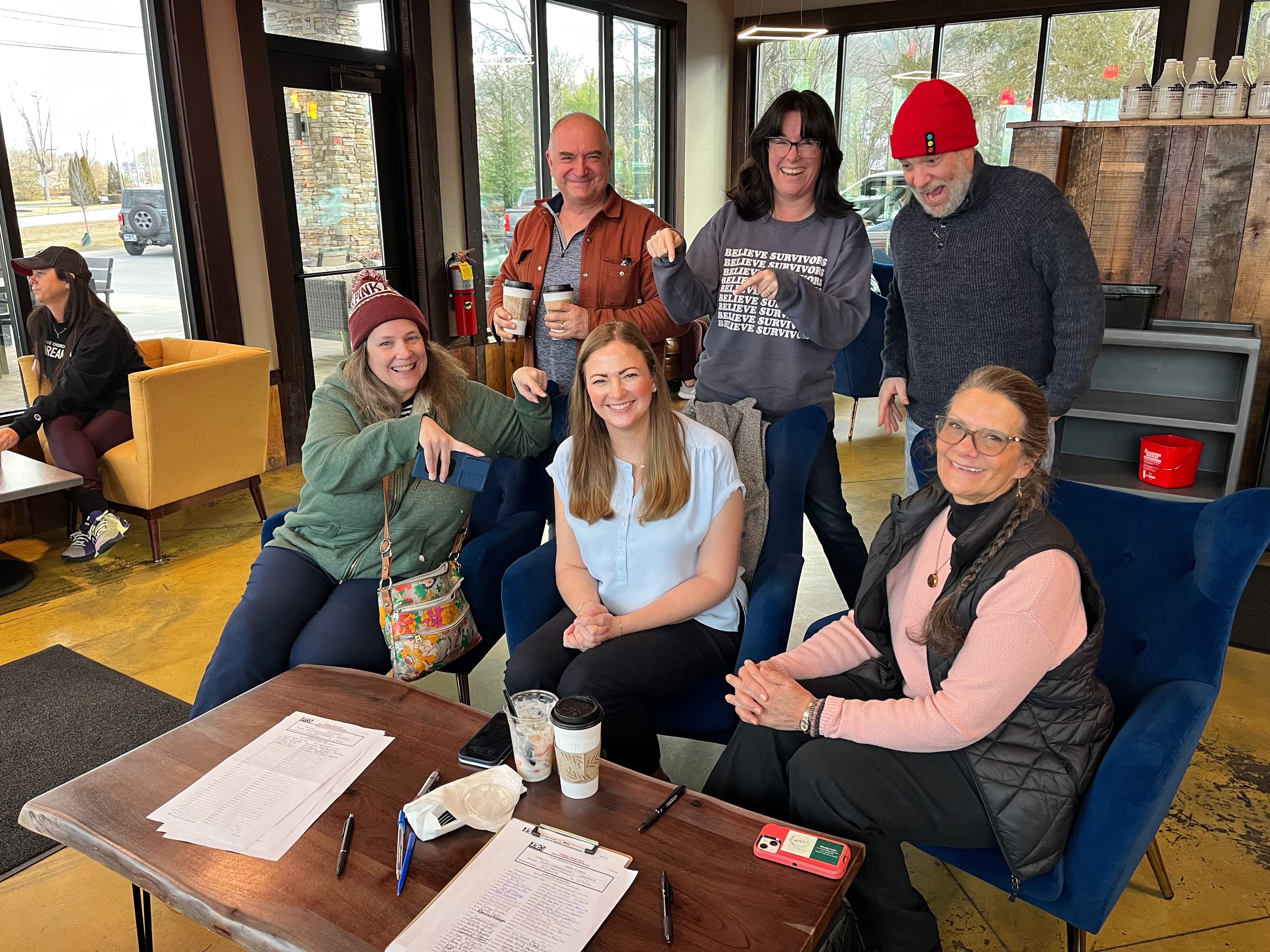 Dr. Ruth Walker meeting with community members at a local coffee shop